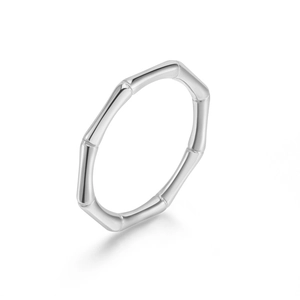 Detailed macro view of a minimalist bamboo style silver ring with high-polish finish