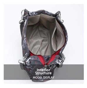 Internal view of gothic skull tote showing grey lining, side pocket and red zipper detail