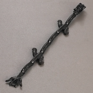 Detailed top view of black plated dragon bracelet with intricate scale textures