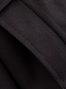 Close-up of navy blue twill fabric showing detailed texture and high-quality stitching
