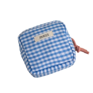Blue and white gingham square mini storage bag with woven zipper pull and logo tag