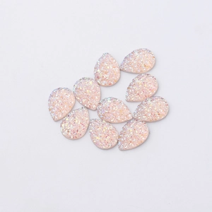 Macro shot of 10 pieces of pink teardrop-shaped glitter resin jewelry accessories