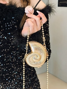 Elegant gold seashell shaped clutch bag with beaded chain strap and spiral texture
