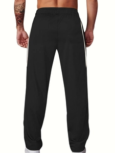 Détail du pantalon en velours côtelé noir pour homme avec rayures et taille élastique