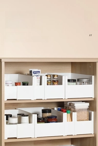 Stackable white plastic storage bins with raised feet for kitchen cabinet organization