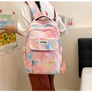 Detailed back view of pink and blue gradient backpack with butterfly and moon prints