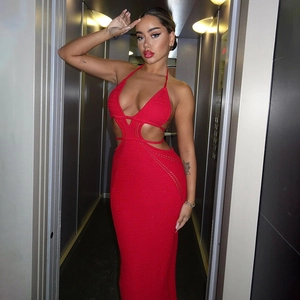 Detailed back view of a red backless knit halter dress with stylish cutout details