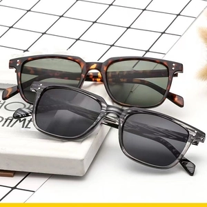 Retro square frame sunglasses in tortoiseshell and grey stripe on a white frame display