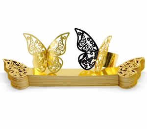 Detailed laser-cut butterfly napkin rings in gold and black with macro hollow patterns