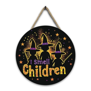 Detail of wooden Halloween sign with witches and I Smell Children text