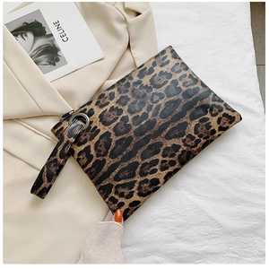 Detailed close-up of a leopard print PU leather envelope clutch with a metal ring handle