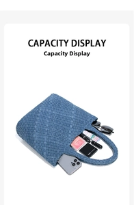 Internal capacity view of woven denim handbag with smartphone, sunglasses and cosmetics