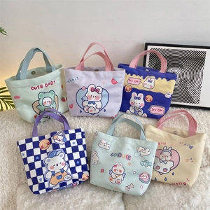 Collection of colorful canvas tote bags with cute cartoon bear and rabbit prints