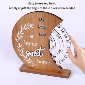 Detail showing the manual adjustment of dates on a wooden creative perpetual calendar