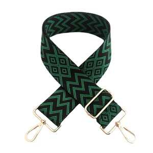 Adjustable 5cm wide woven bag strap with green geometric pattern and gold hardware