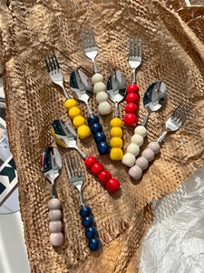 Close-up of 304 stainless steel cutlery with colorful round beaded ceramic handles