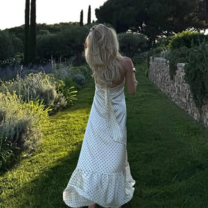 Elegant white polka dot satin halter neck backless maxi dress with tiered ruffle hem