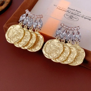 Vintage French geometric tassel earrings with embossed coin design and zircon inlay