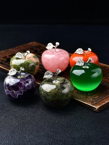 Detail of diverse natural crystal apple decor with sparkling silver leaves and stems