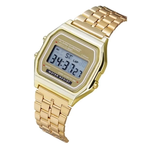 Macro view of gold stainless steel digital watch showing the LCD display and metal band
