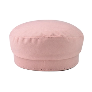 Detailed close-up of pink newsboy hat with refined stitching and flat top structure