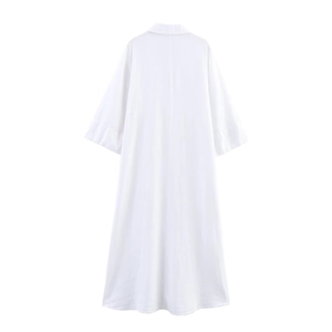 Detailed view of white linen-style shirt dress with A-line cut and classic lapel collar