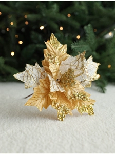 Close-up of a 20cm gold and white sequined artificial Christmas flower for holiday decor