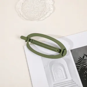 Macro view of matte matcha green hair claw with frosted finish and anti-slip teeth