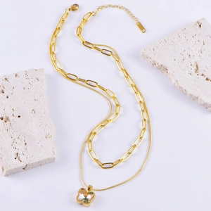 Double-layered golden necklace featuring a butterfly pendant and paperclip chain style
