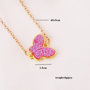 Detailed view of pink glitter butterfly necklace with dimensions 40+5cm and 1.5cm width