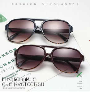 Flat lay of pilot sunglasses in dark grey and purple with leopard print temple detail
