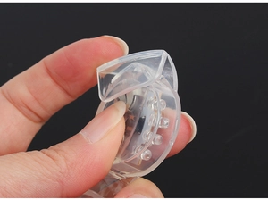 Close-up of flexible transparent silicone LED mouth guard with built-in lights for Halloween