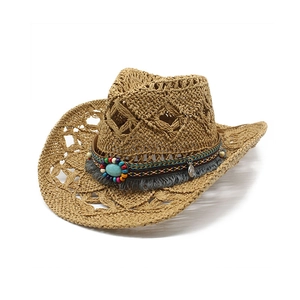 Detail of woven straw cowboy hat featuring ethnic beads, turquoise stone, and fringe