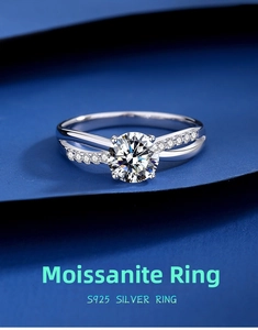 Macro detail of S925 silver moissanite ring with four-prong setting and crossed band design