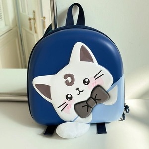Detailed close-up of 3D embossed cat character on a blue hardshell kids backpack