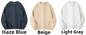 Close-up of ribbed crewneck, cuffs, and hem detail in blue, beige, and light grey