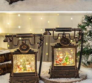 Detail of vintage Christmas phone lanterns with Santa and snowman scenes inside
