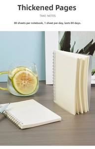 Detail of A5/B5 frosted notebook showing 80 thick blank sheets and silver spiral coil