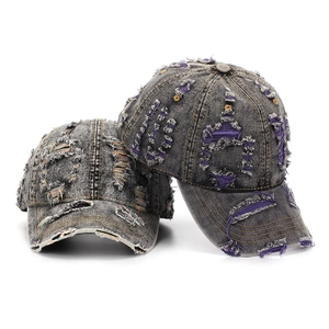 Vintage distressed denim baseball caps with frayed holes and colorful stitching accents