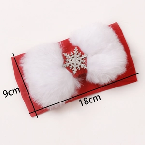 Detailed view of red knitted baby headband with white faux fur and snowflake charms