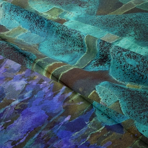 Macro view of bohemian tapestry fabric showing soft folds and blue marble patterns
