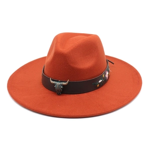 Detail of western hat with bull skull metal buckle and floral embroidery on leather band