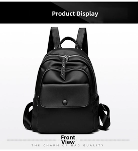 Front view of black pebble leather backpack featuring twin zippers and a magnetic pocket