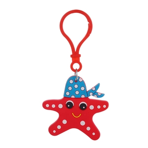 Detail of red cartoon starfish keychain with blue polka dot hat and red plastic hook