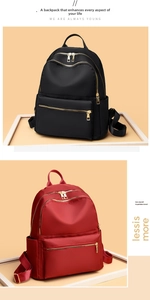 Detail view of large capacity waterproof oxford cloth backpacks in black and wine red