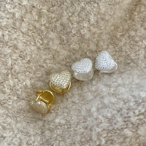 Minimalist heart-shaped stud earrings in gold and silver finish with pavé zircon stones