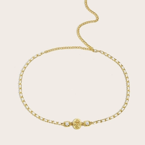 Elegant gold metal waist chain with embossed coin, pearls, and white woven ribbon detail