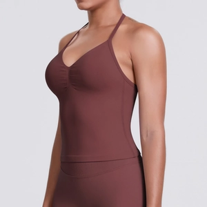 Detail of coffee brown seamless yoga top with thin straps and ruched chest design