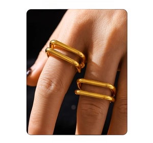 Detail view of double-layered square hollow ring in 18K gold plated finish on model finger