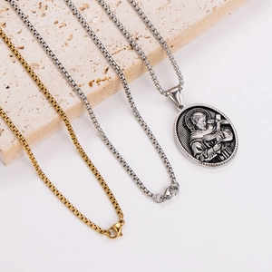 Trend oval relief pendant necklace set with silver and gold chains on stone